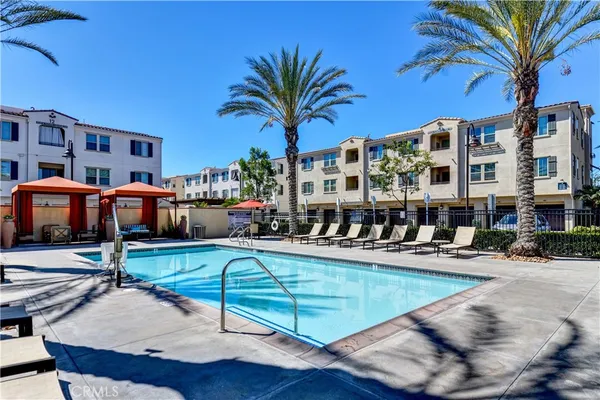 a view of a swimming pool with sitting area