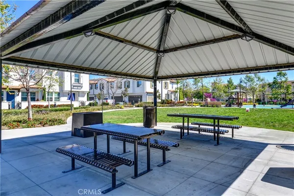 a view of a table and chairs under an umbrella