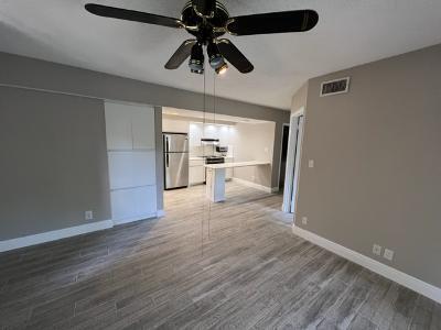 545 Trace Circle, Unit 204 Deerfield Beach, FL 33441 - Photo 3 of 10 a view of empty room with wooden floor