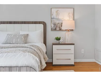 a bedroom with a bed and a dresser