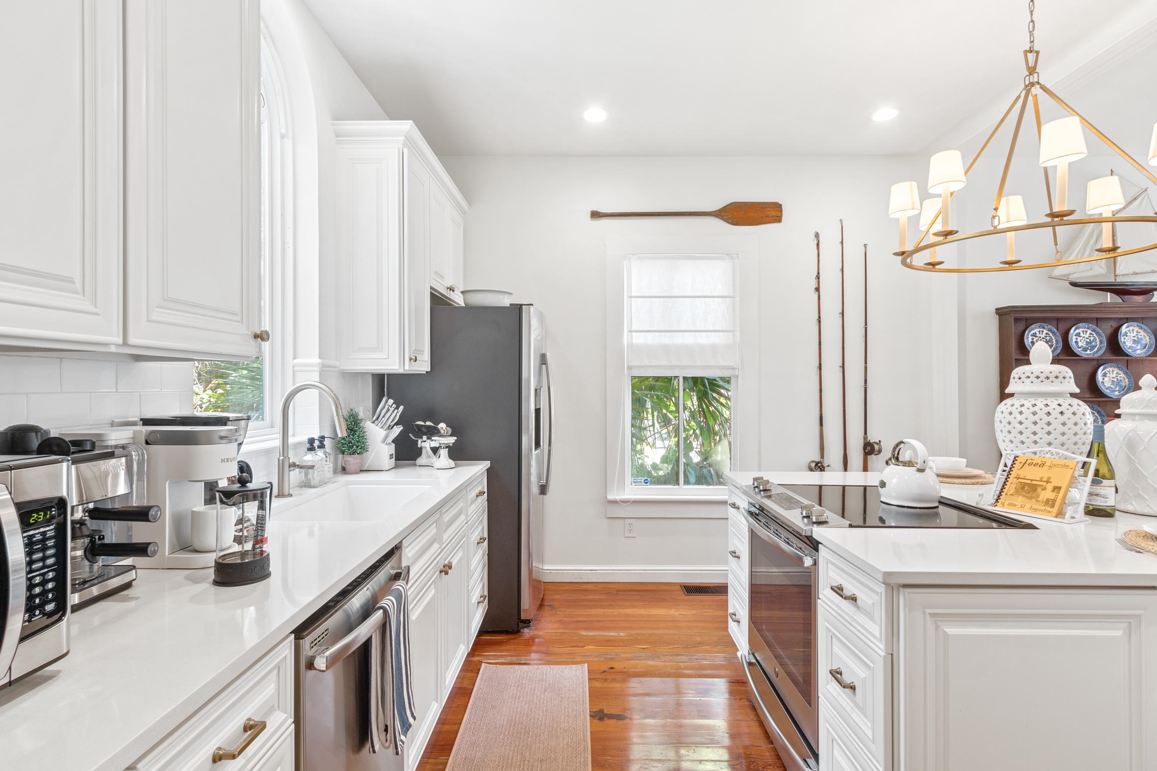 8 Sevilla Street St. Augustine, FL 32084 - Photo 14 of 73 a kitchen with a sink stove and refrigerator