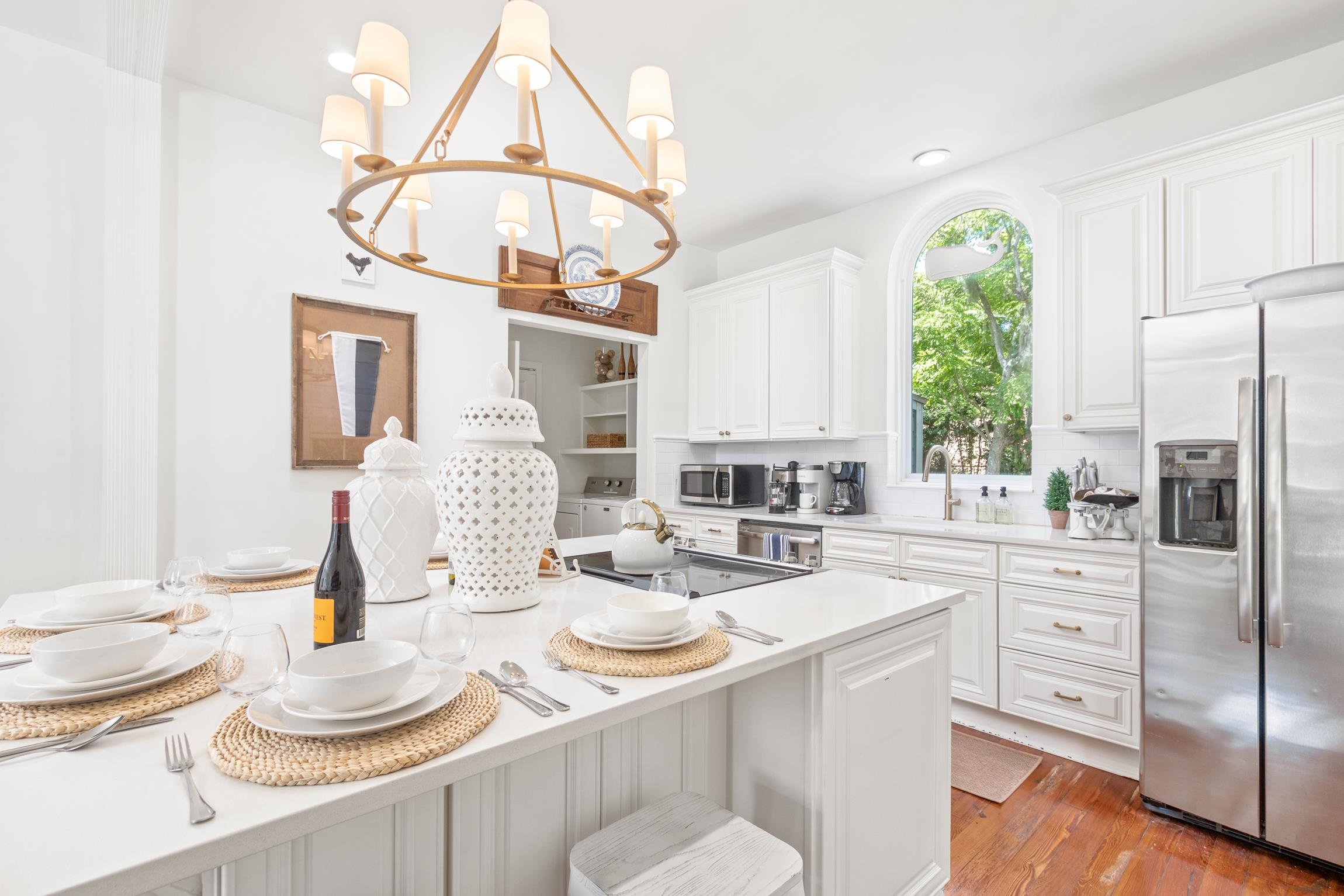 8 Sevilla Street St. Augustine, FL 32084 - Photo 16 of 73 a kitchen with stainless steel appliances granite countertop a sink a stove a dining table and chairs
