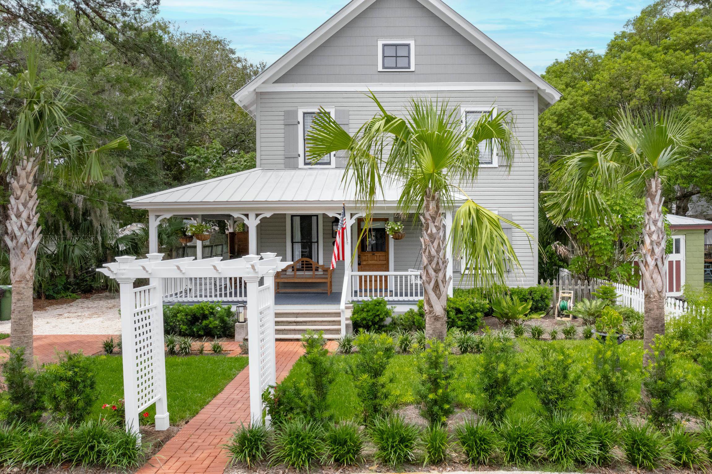 8 Sevilla Street St. Augustine, FL 32084 - Photo 2 of 73 View of front of home featuring covered porch and a metal roof