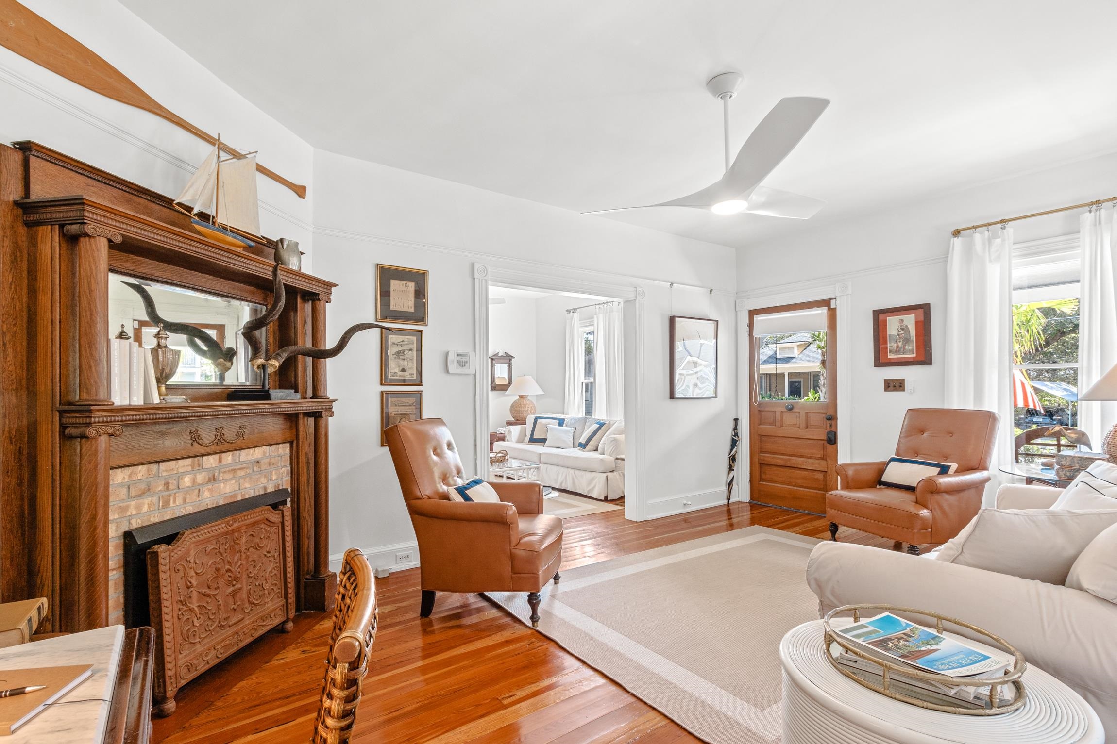 8 Sevilla Street St. Augustine, FL 32084 - Photo 22 of 73 a living room with furniture a fireplace and a large window