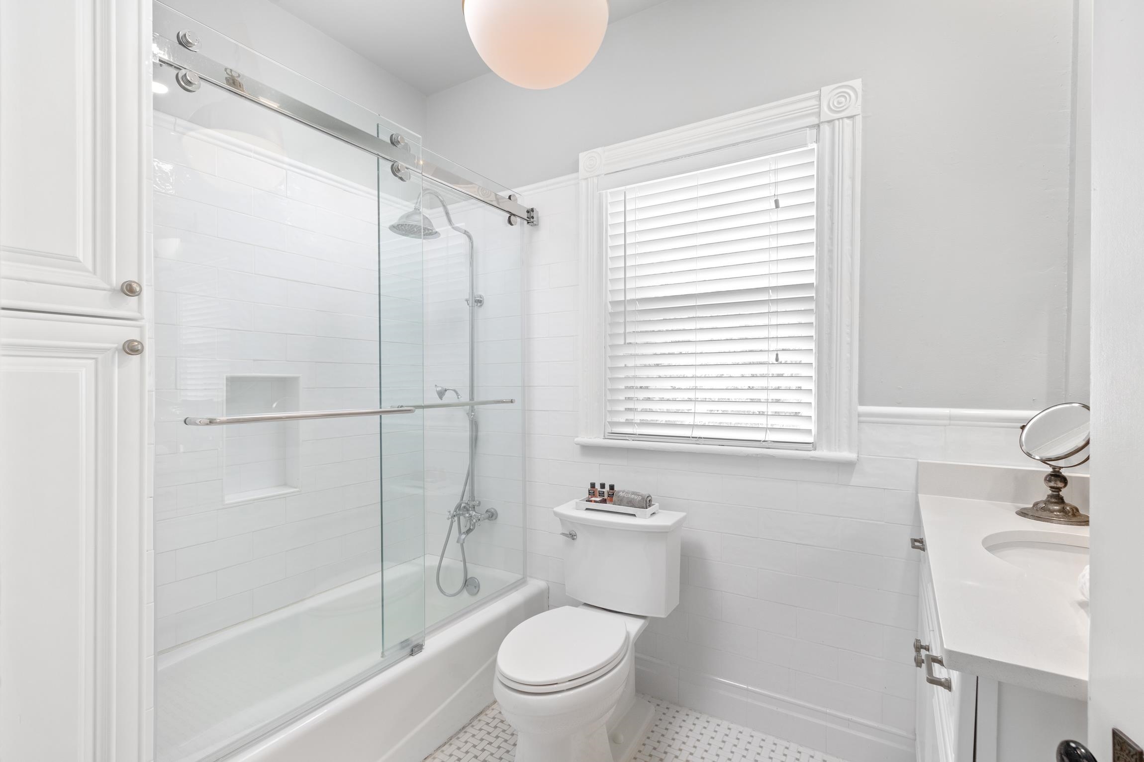 8 Sevilla Street St. Augustine, FL 32084 - Photo 31 of 73 a bathroom with a shower a toilet and a sink