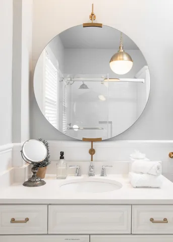 a living room with furniture and a lamp