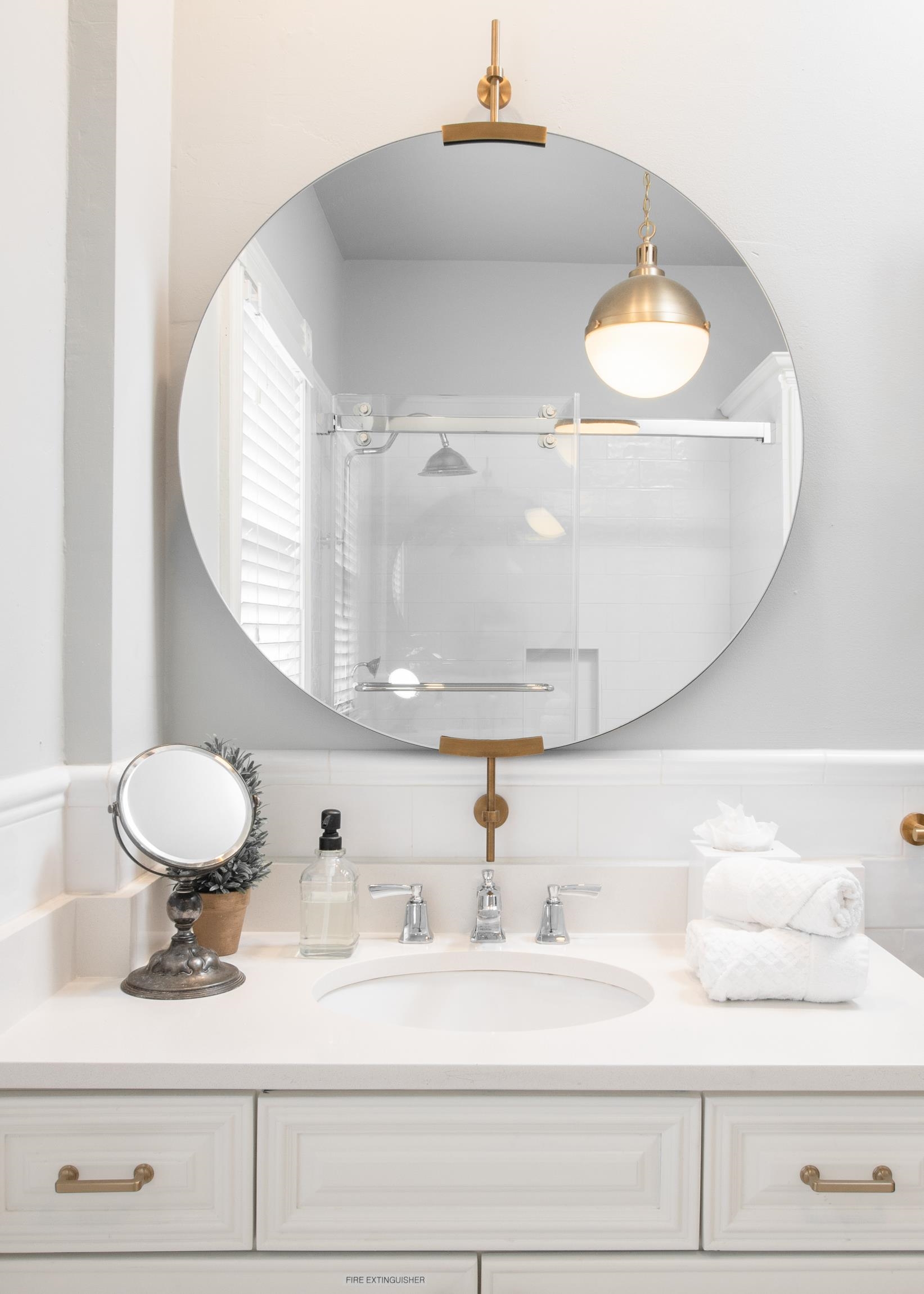 8 Sevilla Street St. Augustine, FL 32084 - Photo 33 of 73 a bathroom with a sink mirror and vanity