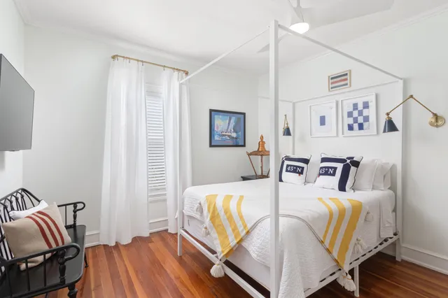 a view of a sink and a table in a kitchen