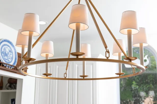 a view of a house with a yard and potted plants