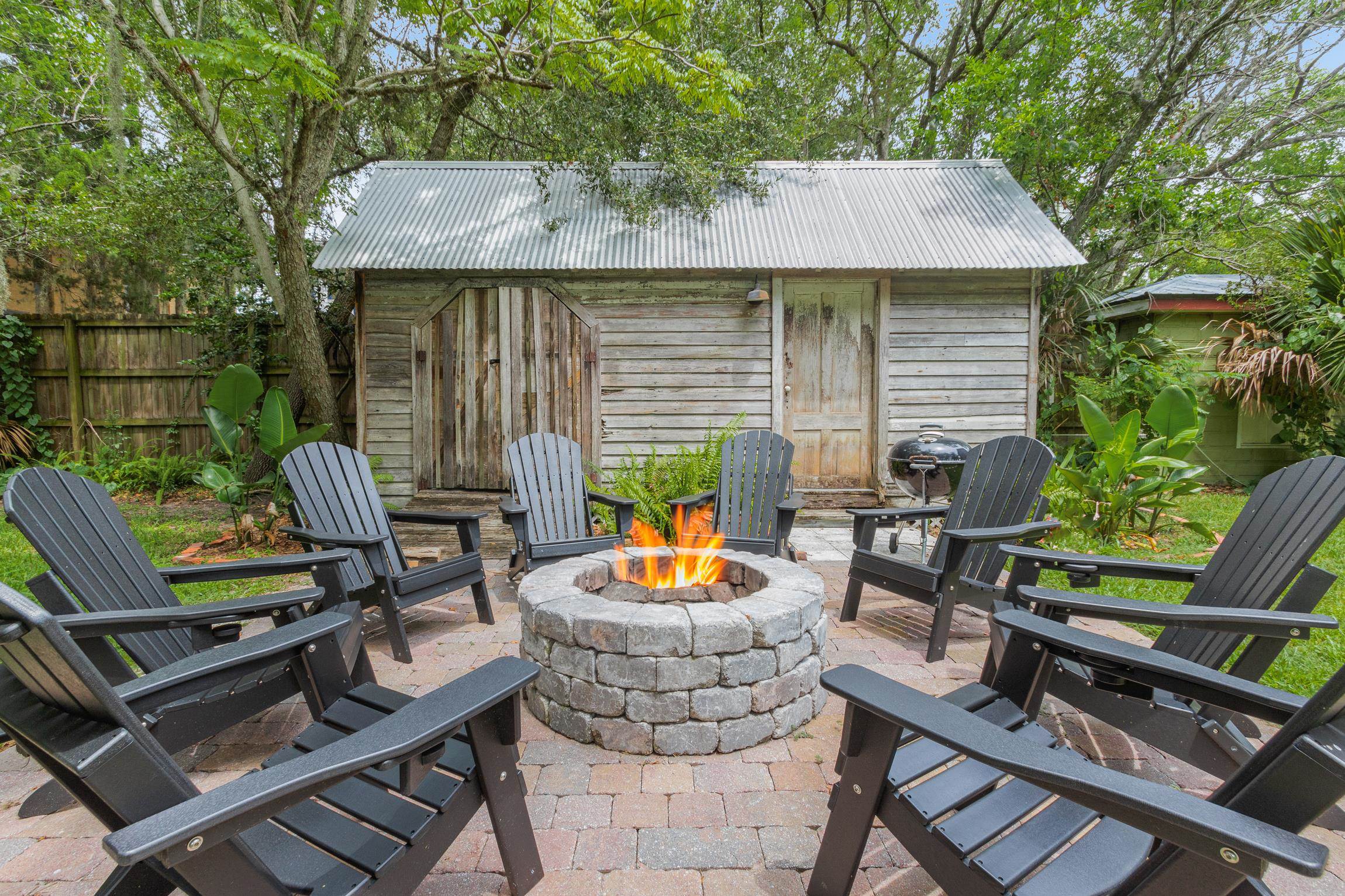8 Sevilla Street St. Augustine, FL 32084 - Photo 56 of 73 View of patio / terrace featuring a storage unit and a fire pit