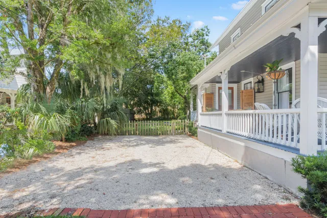 a view of a house with a yard and plants