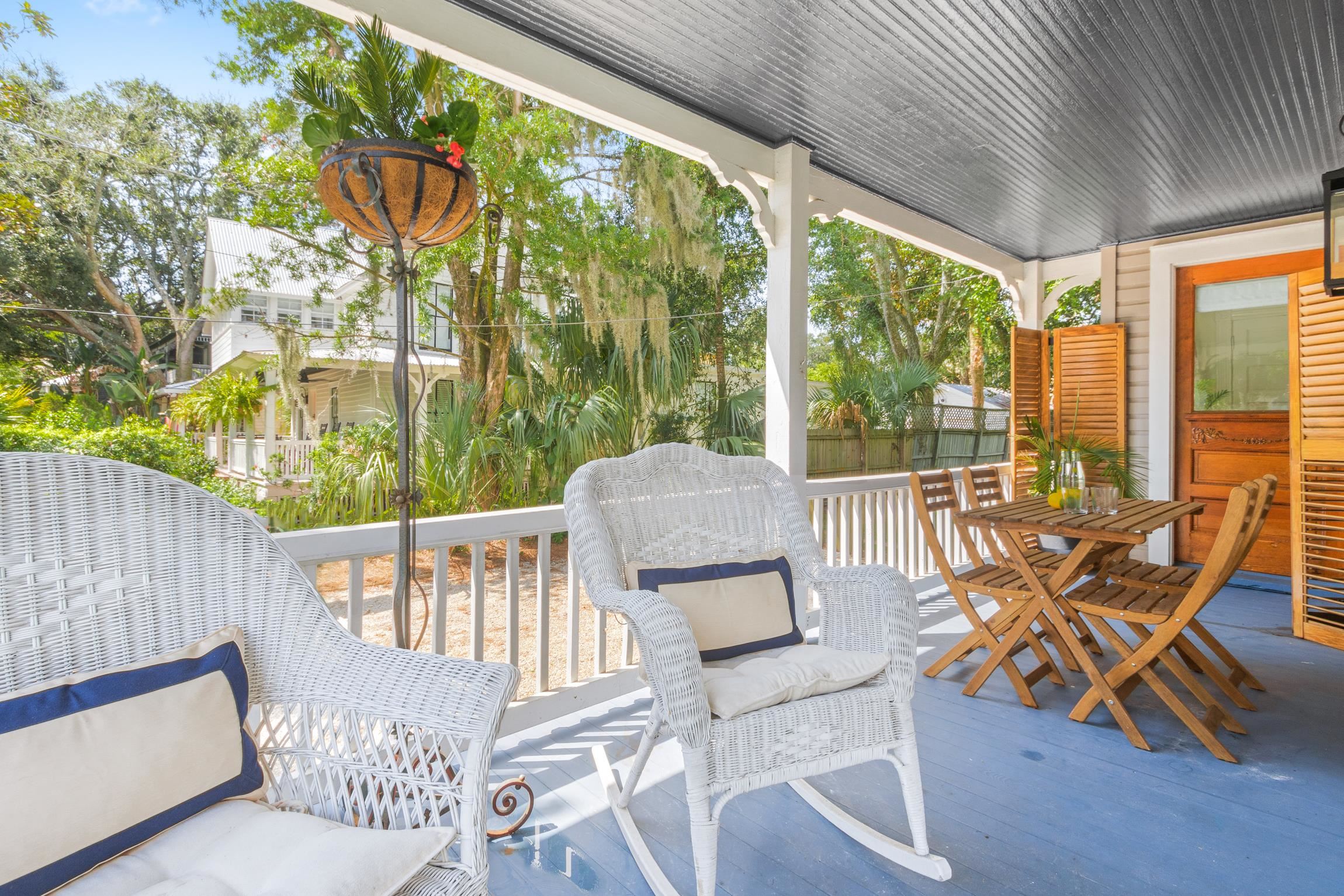 8 Sevilla Street St. Augustine, FL 32084 - Photo 10 of 73 a view of a patio with a table chairs and a glass door