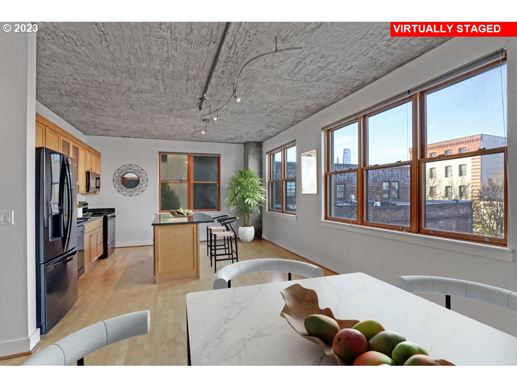411 Northwest Flanders Street, Unit 401 Portland, OR 97209 - Photo 11 of 38 a living room with furniture two window and flat screen tv