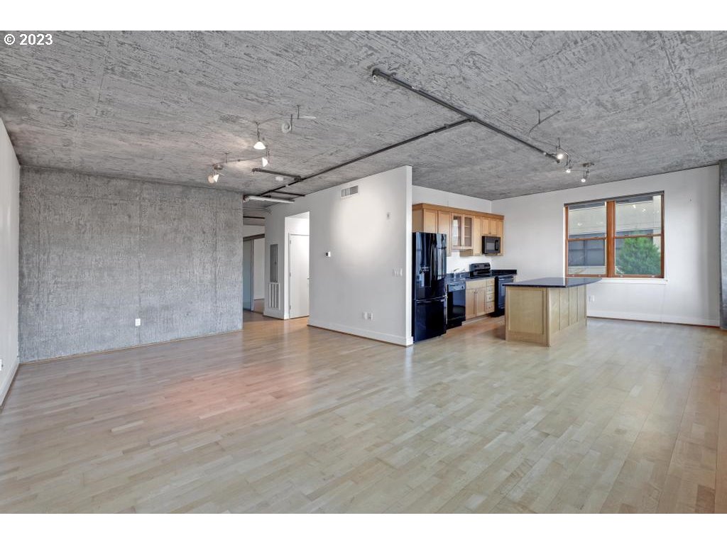 411 Northwest Flanders Street, Unit 401 Portland, OR 97209 - Photo 19 of 38 a view of a livingroom with wooden floor