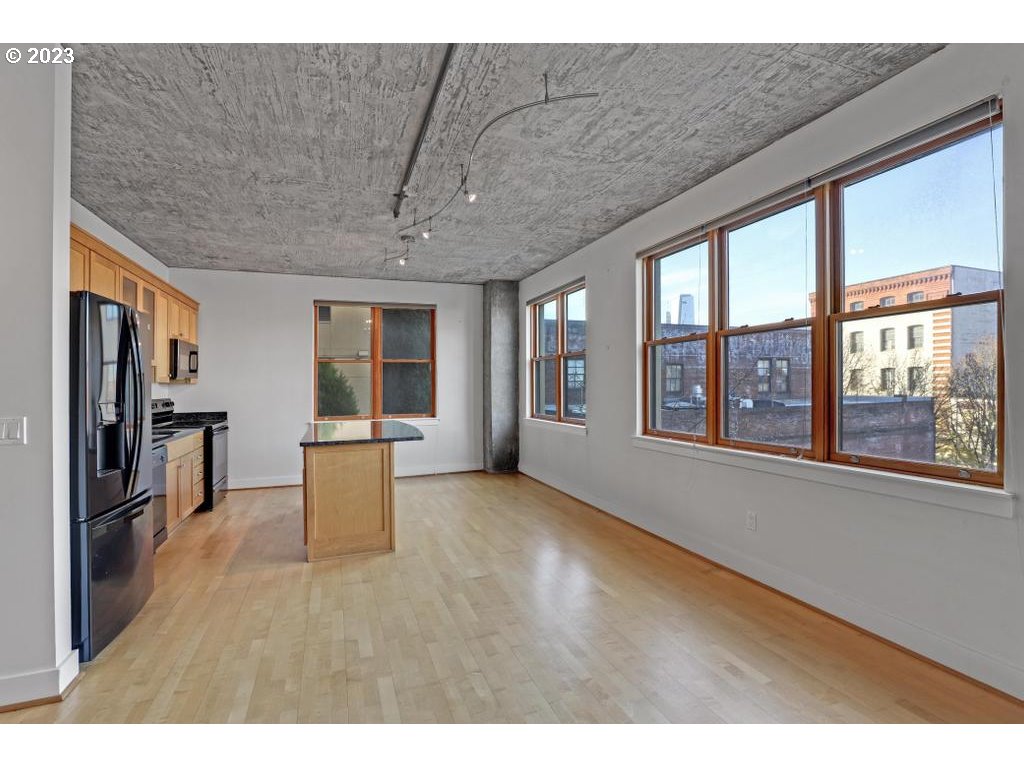 411 Northwest Flanders Street, Unit 401 Portland, OR 97209 - Photo 21 of 38 a view of an empty room with a window