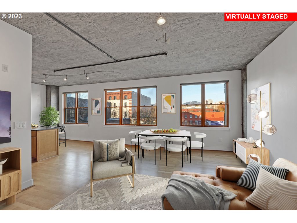 411 Northwest Flanders Street, Unit 401 Portland, OR 97209 - Photo 10 of 38 a living room with furniture kitchen view and a large window