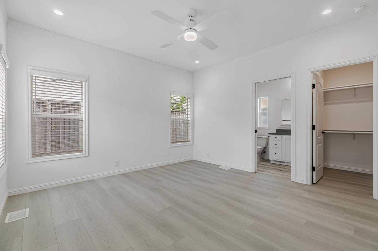 555 Umbarger Road, Unit 131 San Jose, CA 95111 - Photo 22 of 32 wooden floor in an empty room with a window