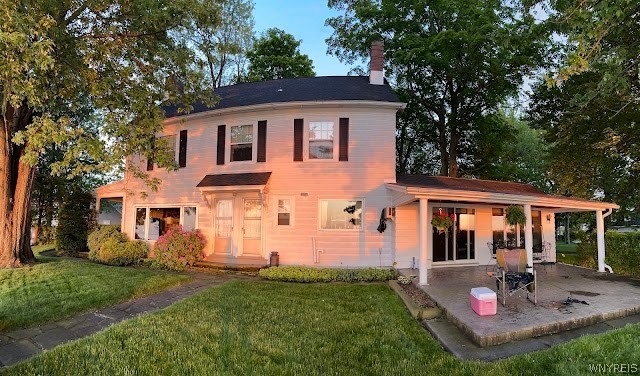 4998 Lake Shore Road Hamburg, NY 14075 - Photo 11 of 44 REAR OF HOME AT SUNSET/DUSK