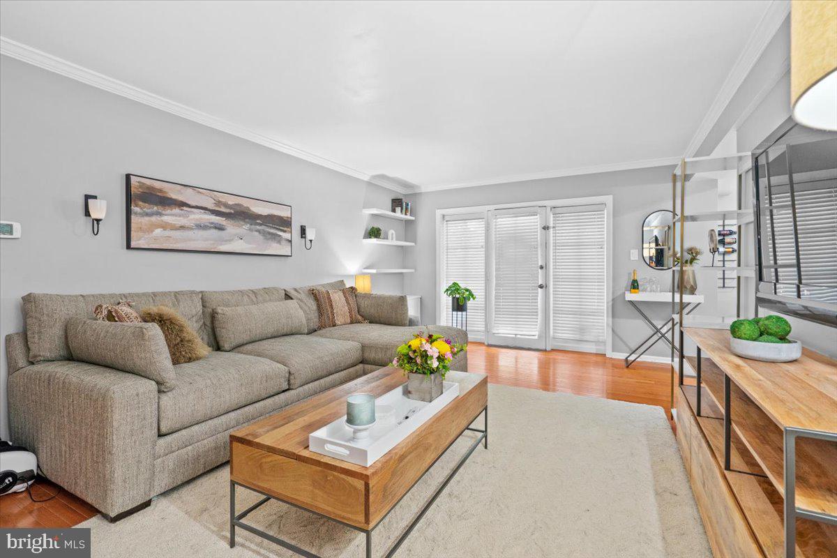 3332 Spring Lane, Unit C10 Falls Church, VA 22041 - Photo 12 of 25 a living room with furniture and a table