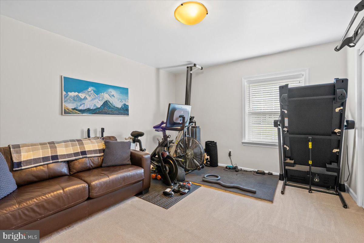 3332 Spring Lane, Unit C10 Falls Church, VA 22041 - Photo 16 of 25 a view of a livingroom with furniture and a window