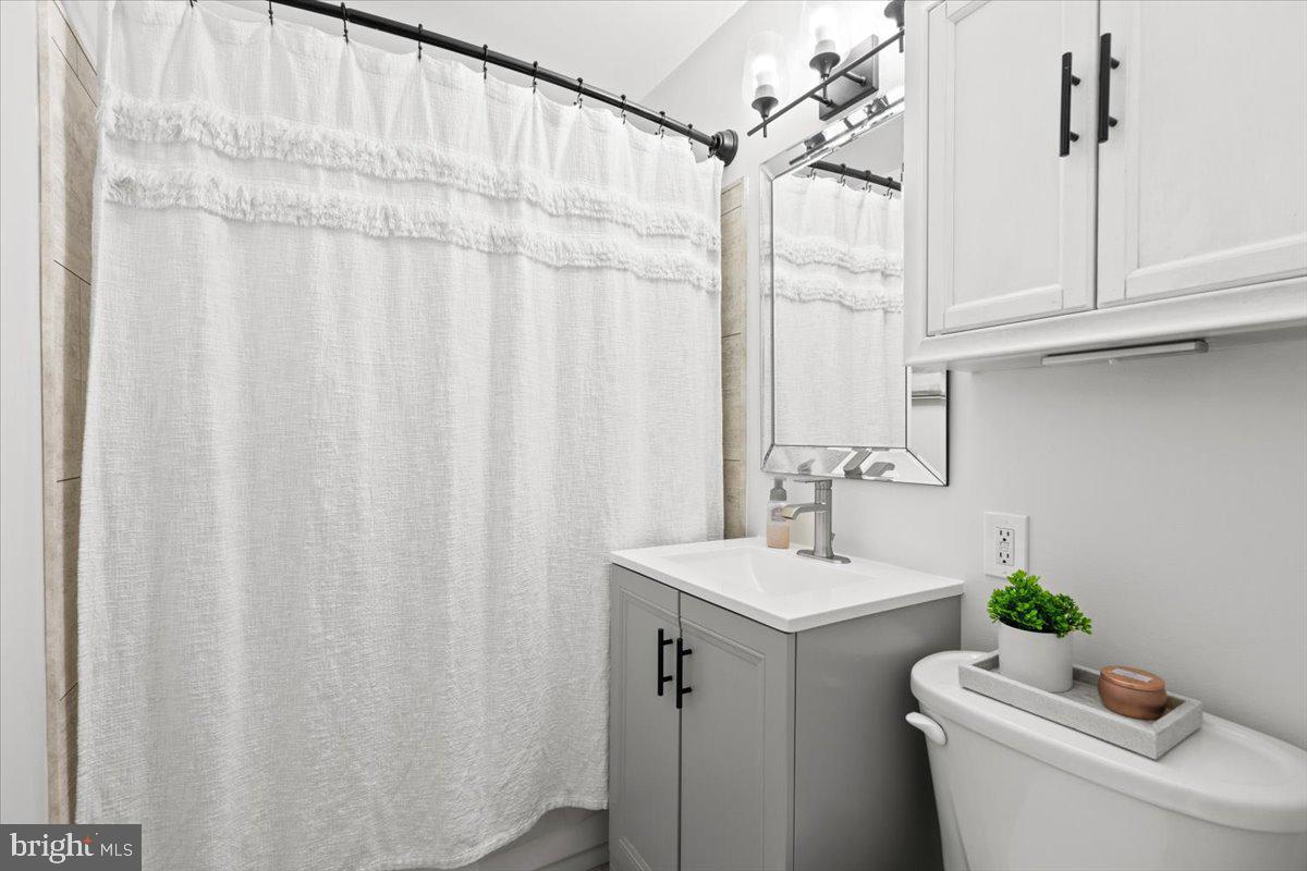 3332 Spring Lane, Unit C10 Falls Church, VA 22041 - Photo 19 of 25 a bathroom with a sink and a mirror