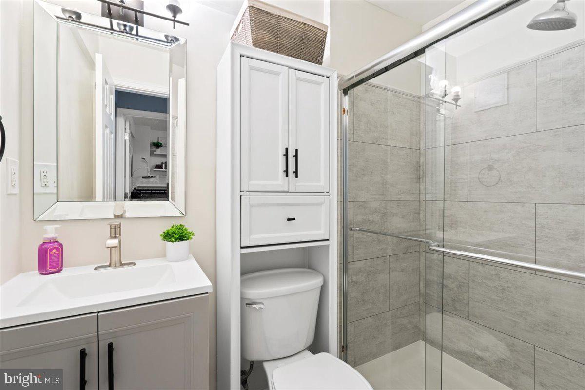 3332 Spring Lane, Unit C10 Falls Church, VA 22041 - Photo 20 of 25 a bathroom with a sink toilet and shower