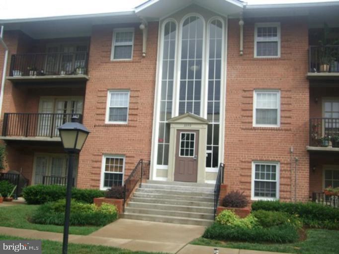 3332 Spring Lane, Unit C10 Falls Church, VA 22041 - Photo 2 of 25 a front view of a house with a yard