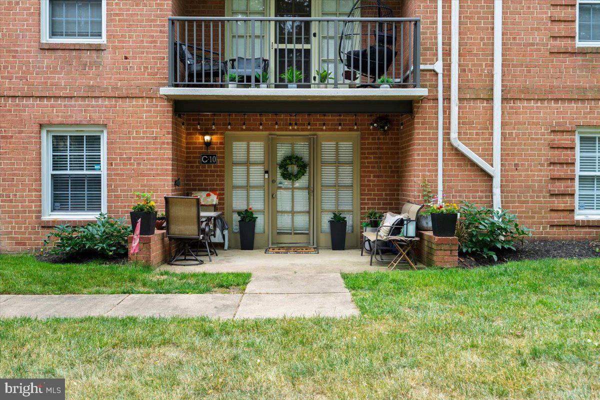 3332 Spring Lane, Unit C10 Falls Church, VA 22041 - Photo 23 of 25 a front view of a house with patio and garden