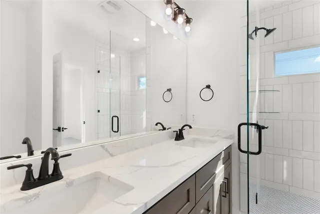 a bathroom with a shower and a mirror