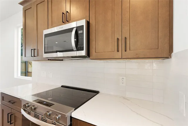 a close view of a utility room with washer and dryer