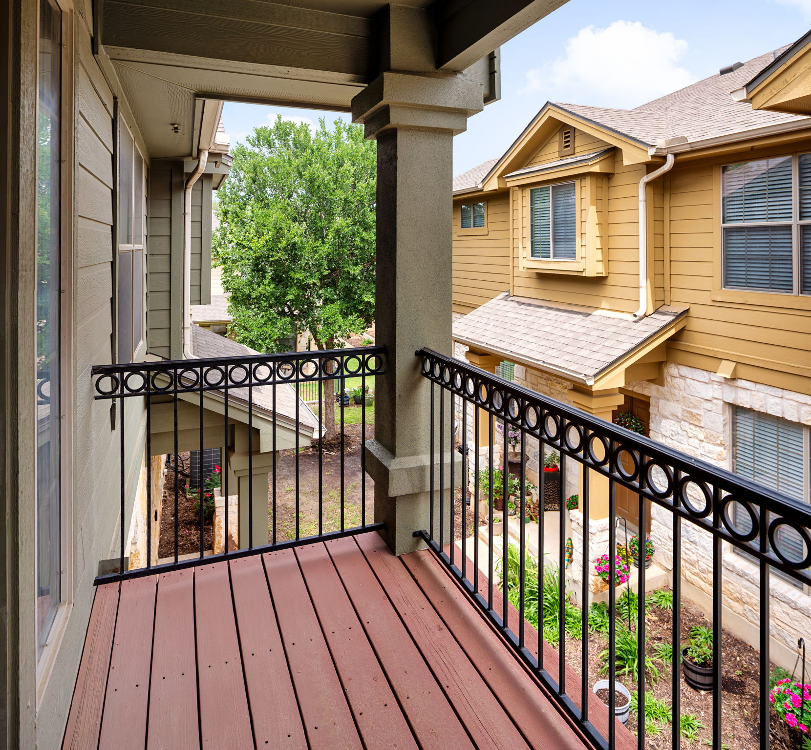 14815 Avery Ranch Boulevard, Unit 1401 Austin, TX 78717 - Photo 9 of 38 Private balcony featuring composite decking and decorative wrought iron railing