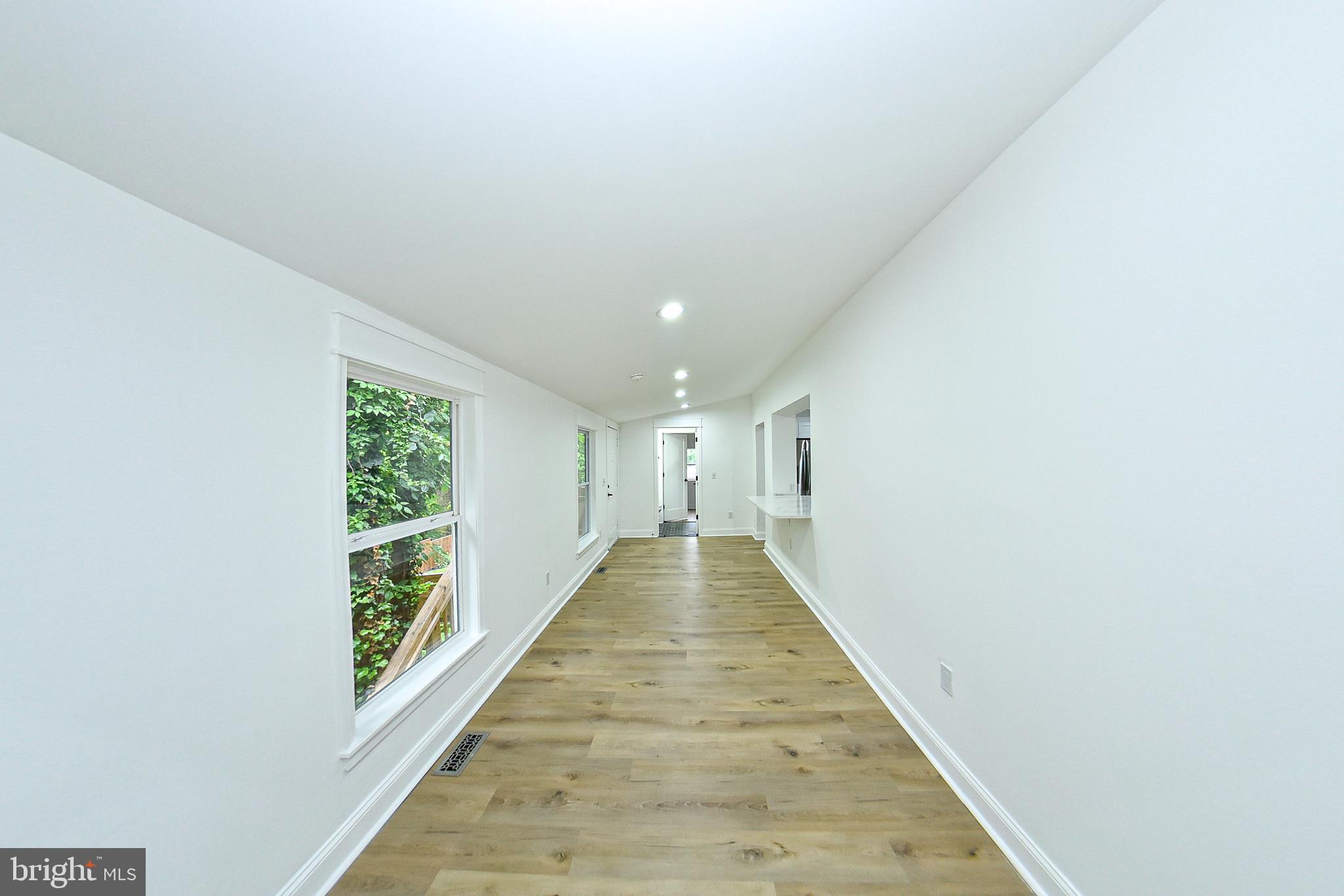 3704 Suitland Road Southeast Washington, DC 20020 - Photo 19 of 70 a view of gallery with wooden floor
