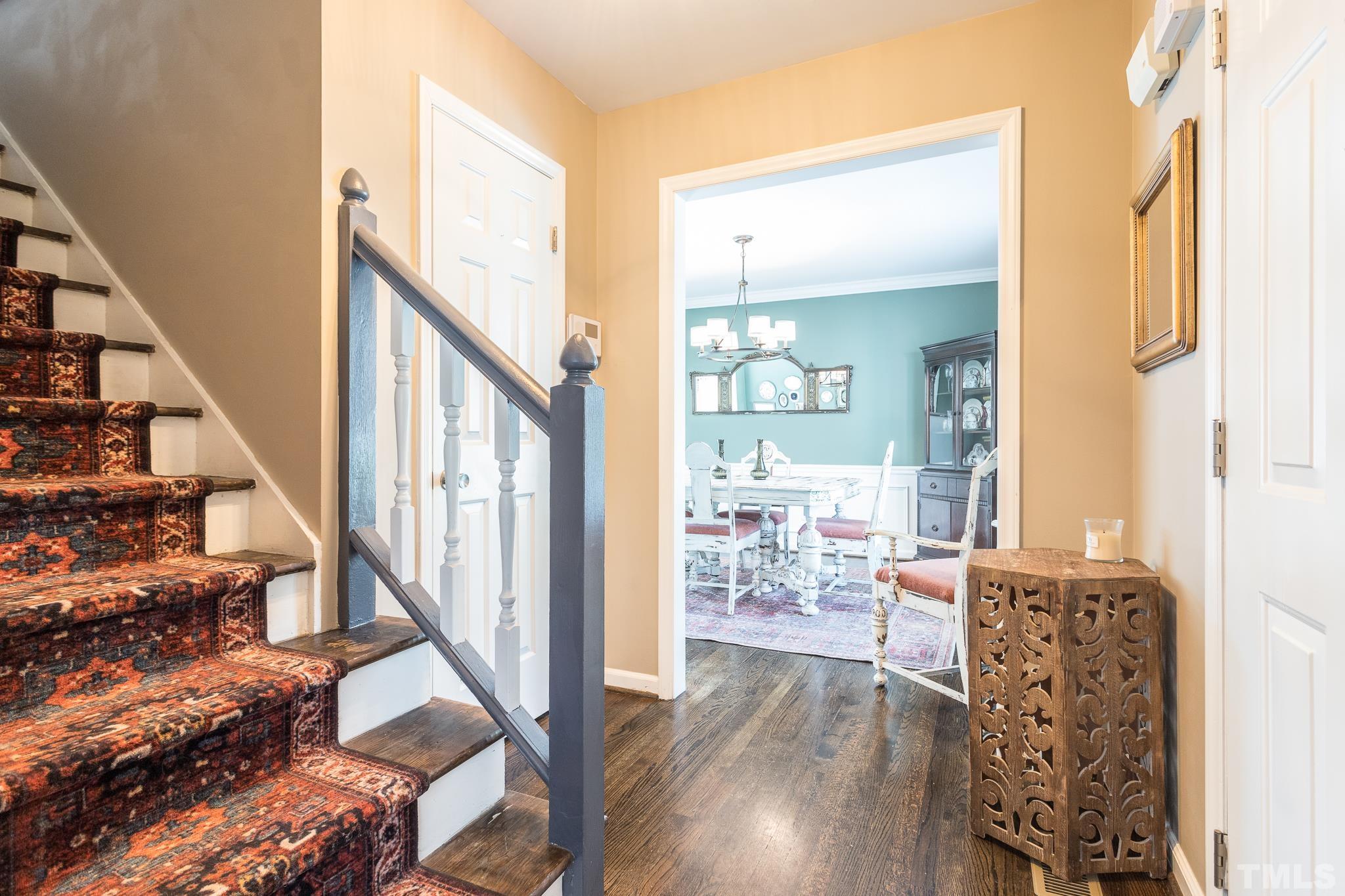 7440 Deer Track Drive Raleigh, NC 27613 - Photo 3 of 38 a view of a hallway with wooden floor and stairs