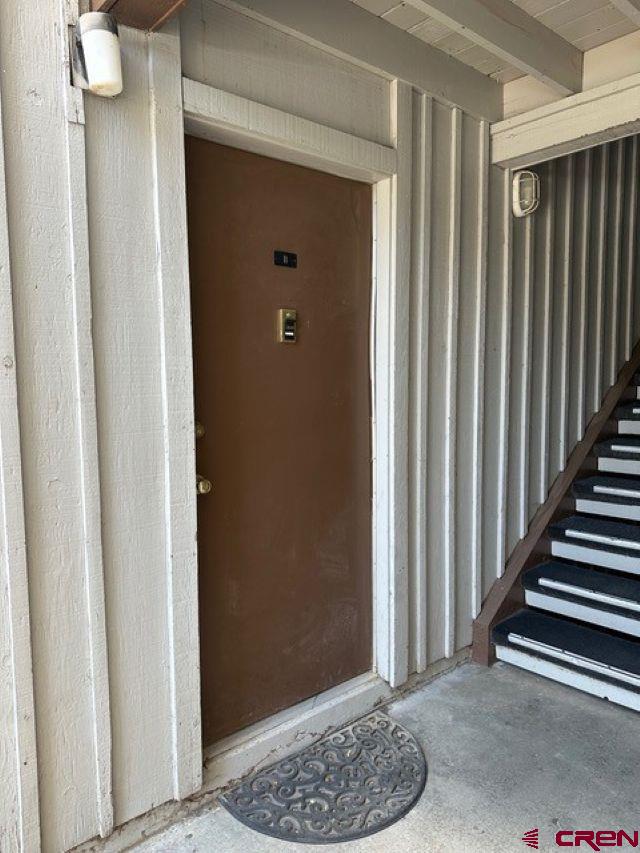 34237 Highway 550, Unit 11 Durango, CO 81301 - Photo 1 of 2 a view of entryway with wooden floor and stairs