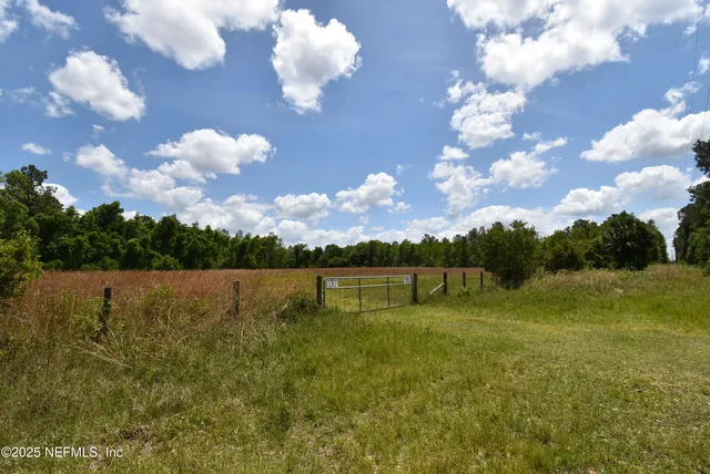 a view of a lake with houses in the background