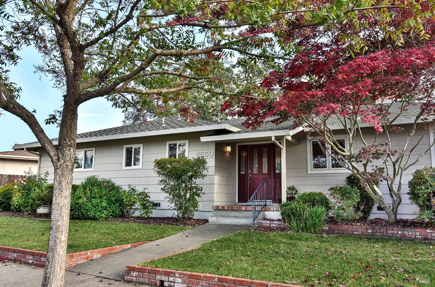 a front view of a house with garden