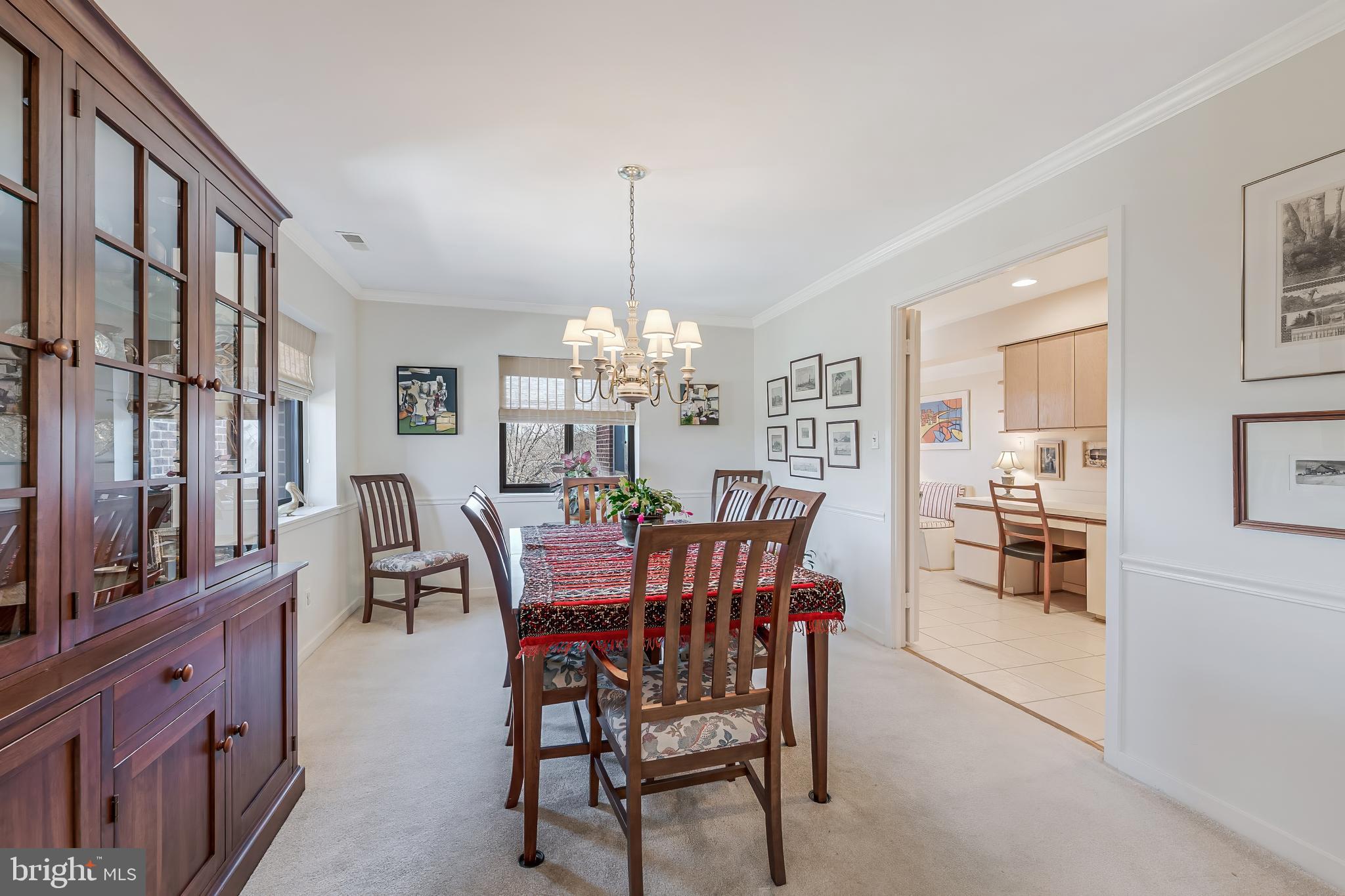 11500 Fairway Drive, Unit 507 Reston, VA 20190 - Photo 11 of 41 a view of a dining room with furniture and chandelier
