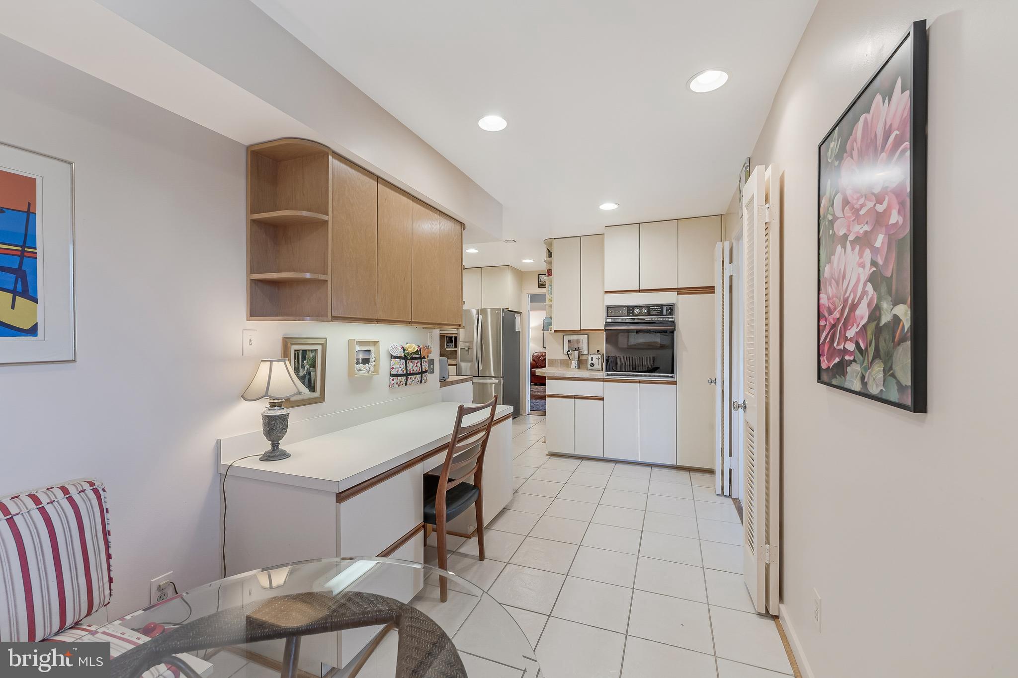 11500 Fairway Drive, Unit 507 Reston, VA 20190 - Photo 21 of 41 a kitchen with a sink cabinets and stainless steel appliances