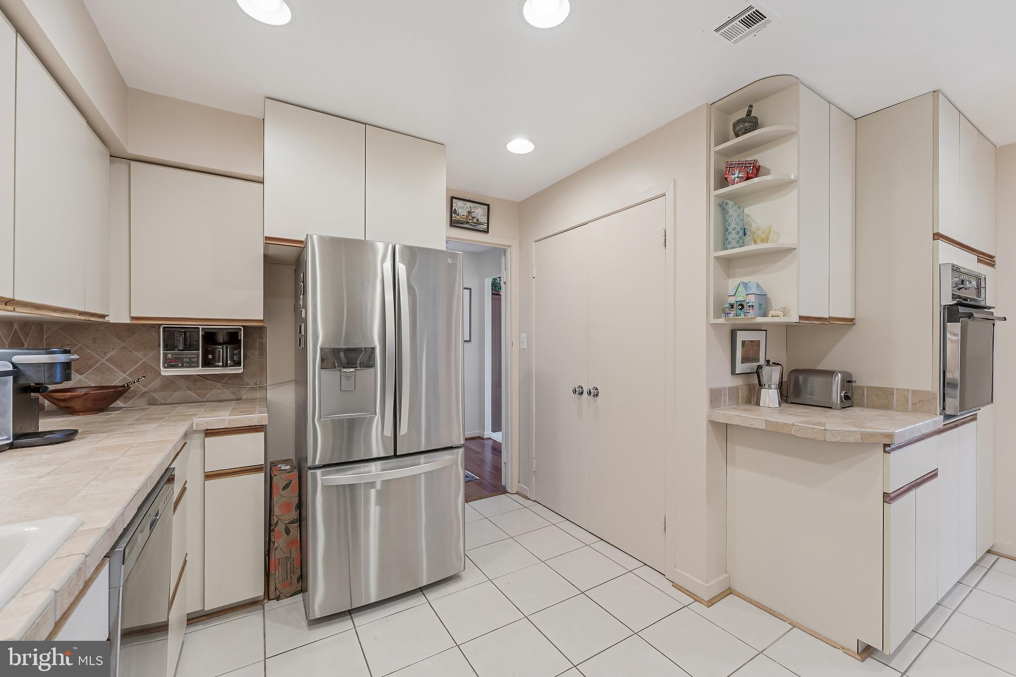 11500 Fairway Drive, Unit 507 Reston, VA 20190 - Photo 22 of 41 a kitchen with stainless steel appliances granite countertop a refrigerator and a sink