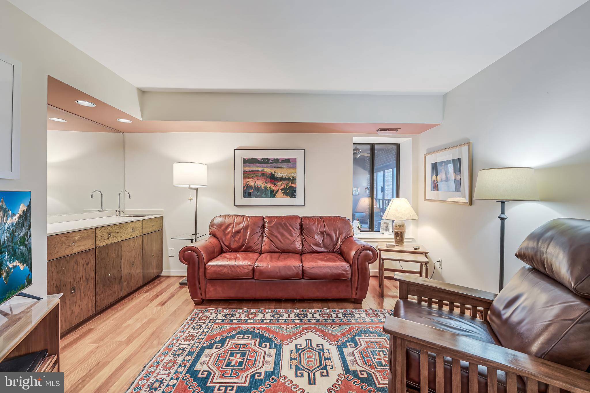 11500 Fairway Drive, Unit 507 Reston, VA 20190 - Photo 35 of 41 a living room with furniture and a lamp