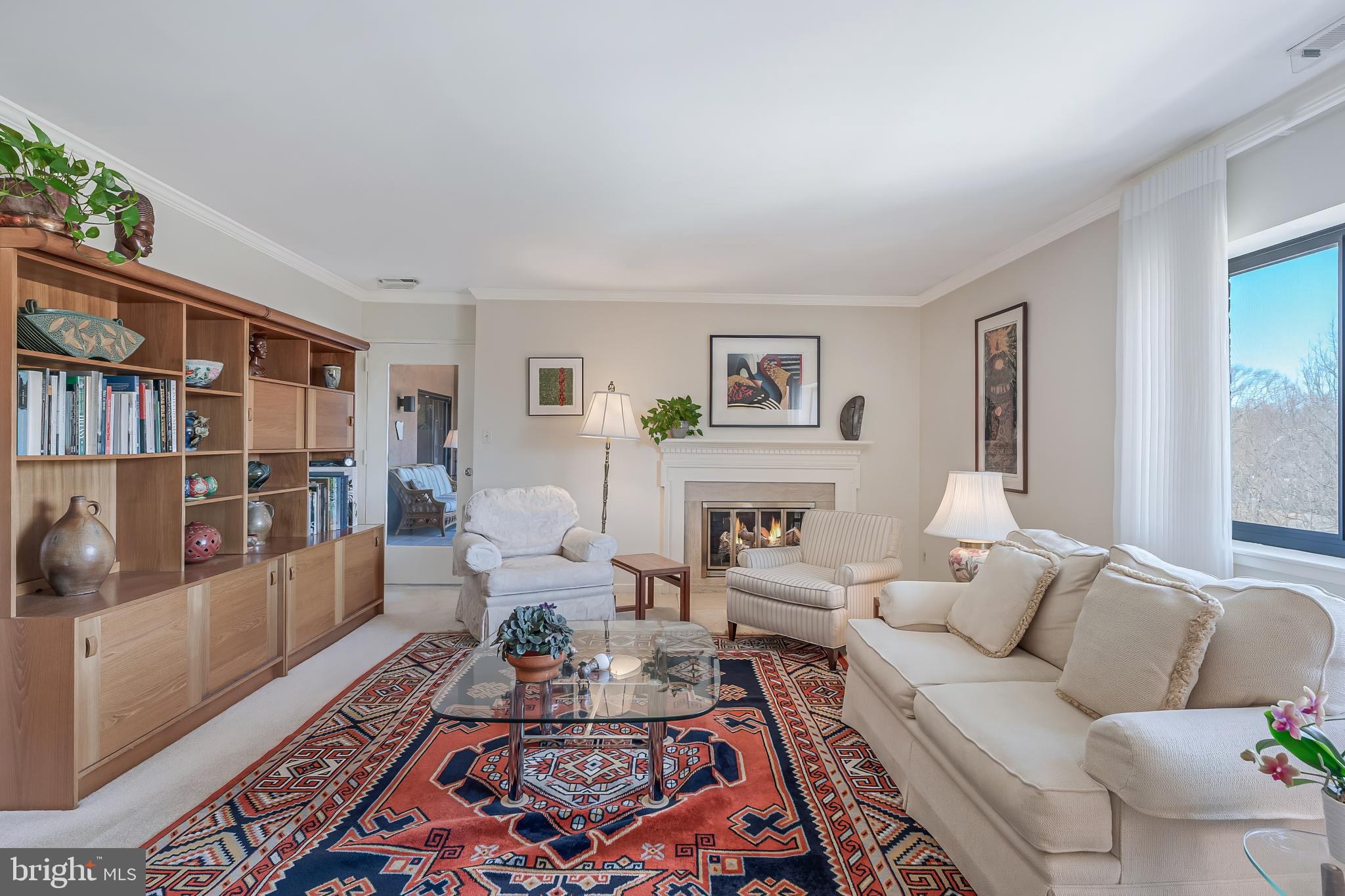 11500 Fairway Drive, Unit 507 Reston, VA 20190 - Photo 8 of 41 a living room with furniture and a book shelf