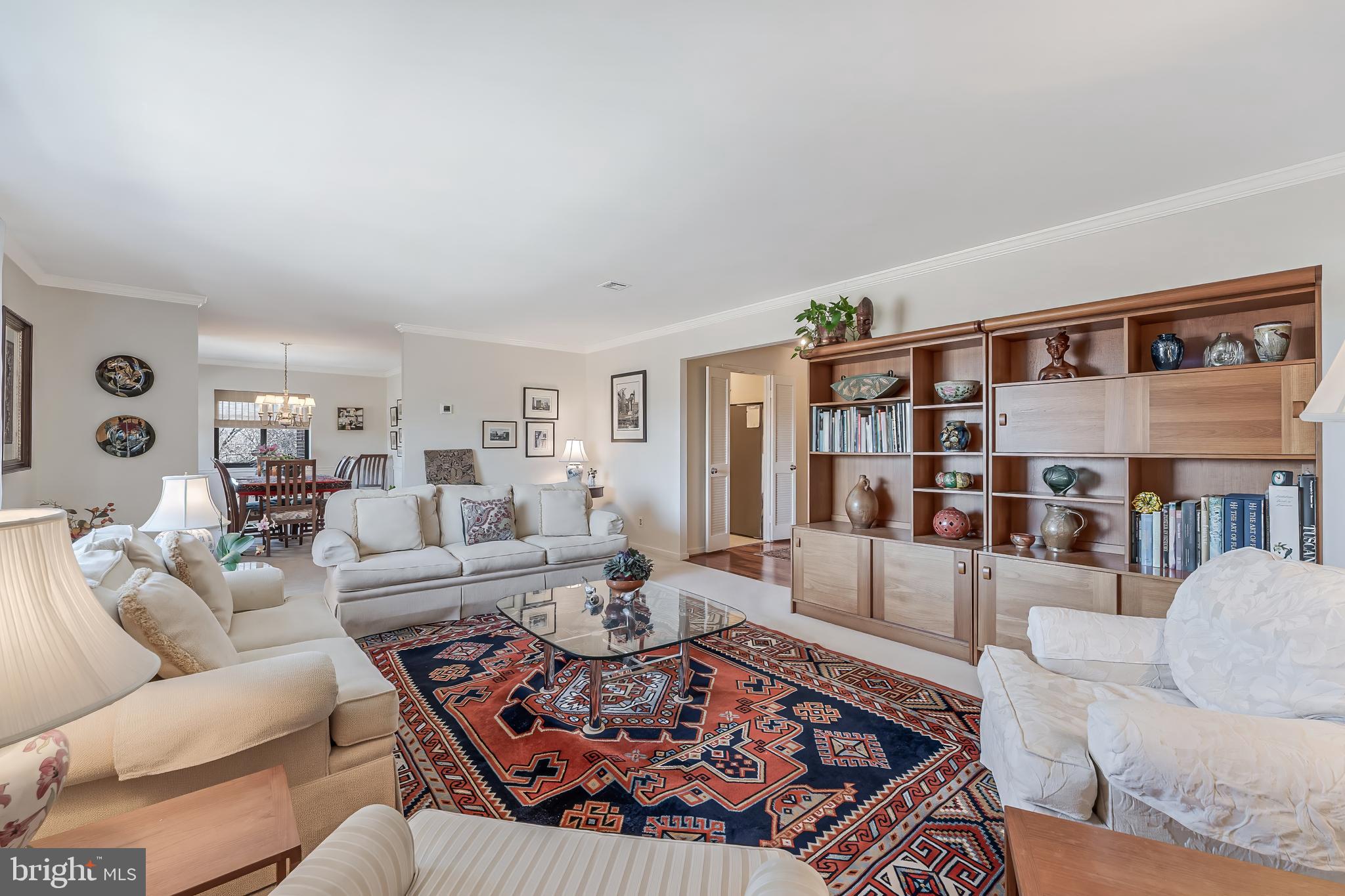 11500 Fairway Drive, Unit 507 Reston, VA 20190 - Photo 9 of 41 a living room with furniture and book shelf