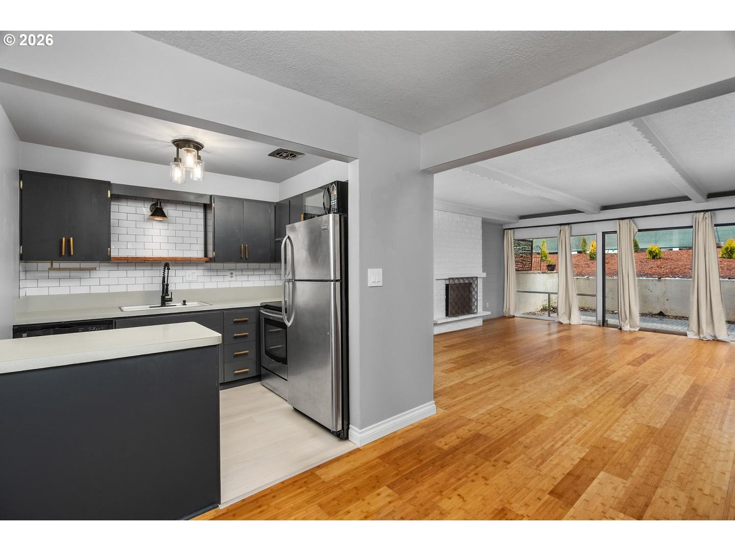 4460 Southwest Scholls Ferry Road, Unit 8 Portland, OR 97225 - Photo 17 of 31 a kitchen with stainless steel appliances granite countertop a refrigerator and a sink