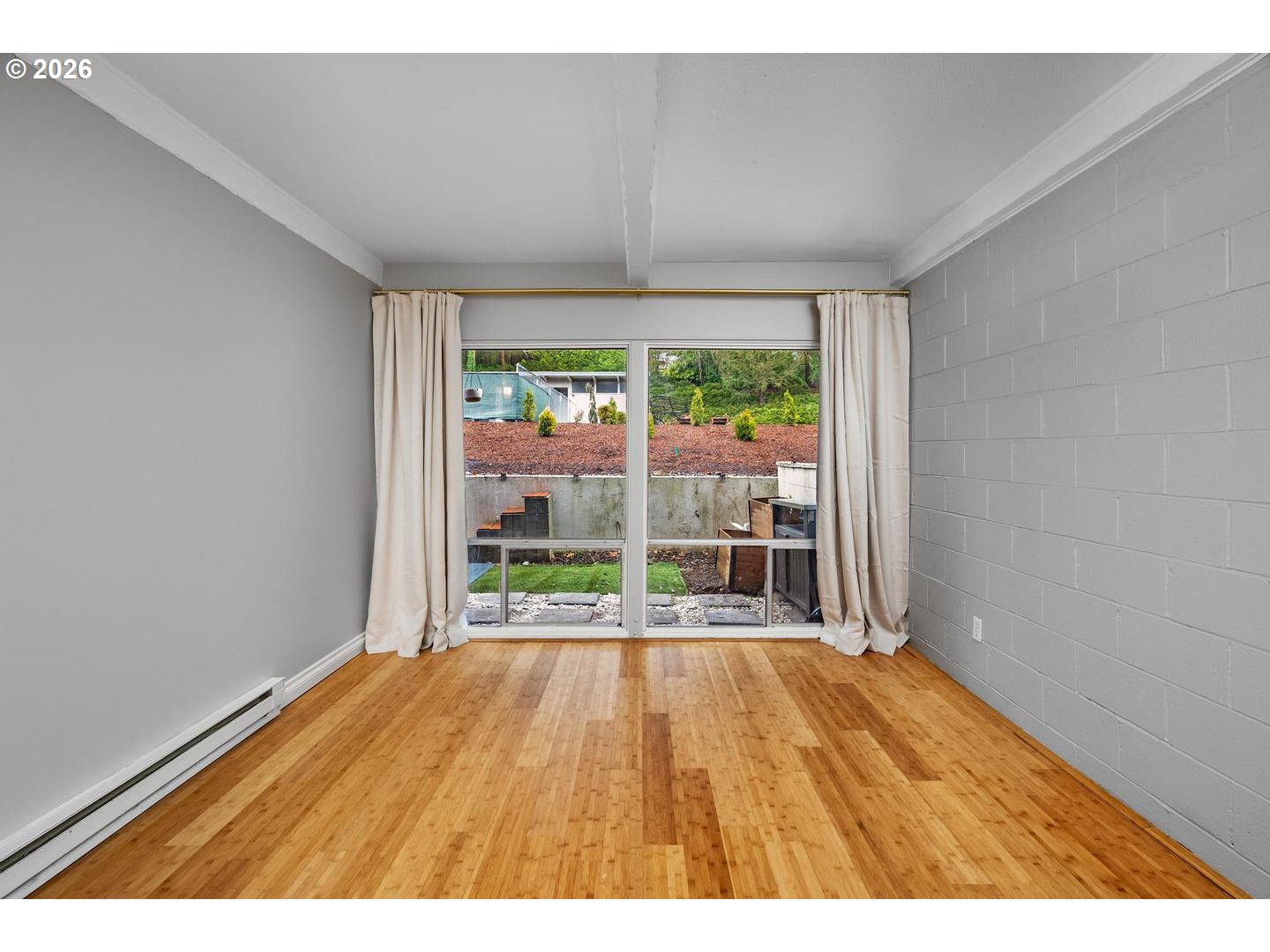 4460 Southwest Scholls Ferry Road, Unit 8 Portland, OR 97225 - Photo 18 of 31 a view of empty room with wooden floor and fan