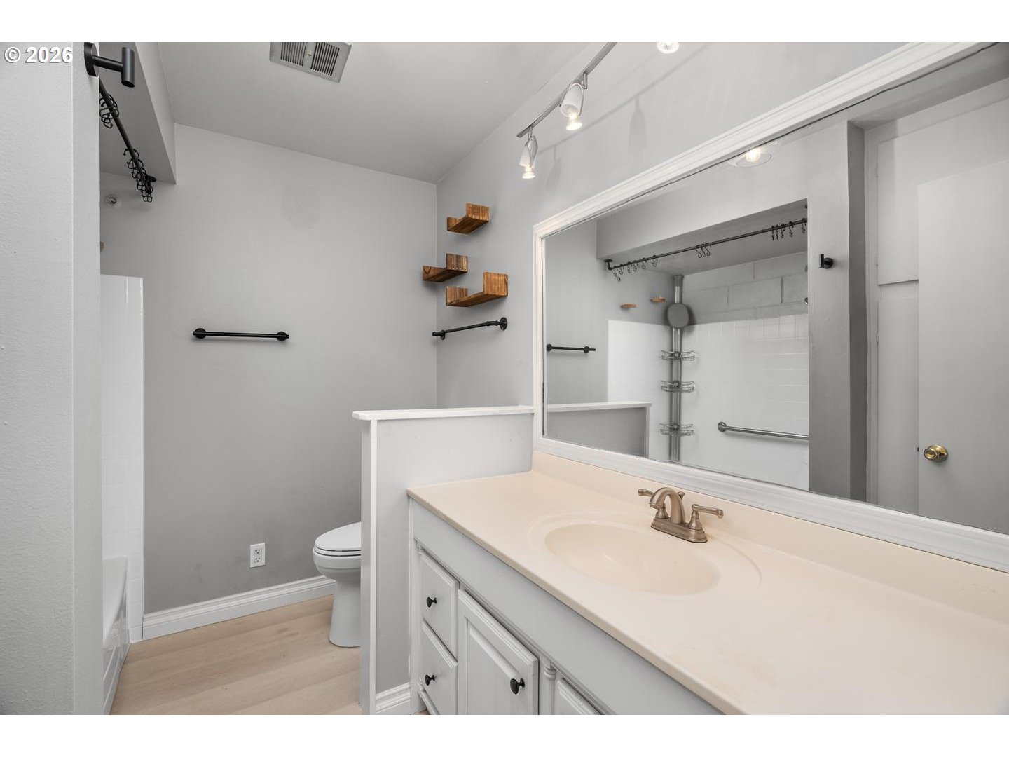 4460 Southwest Scholls Ferry Road, Unit 8 Portland, OR 97225 - Photo 21 of 31 a bathroom with a sink a toilet and shower