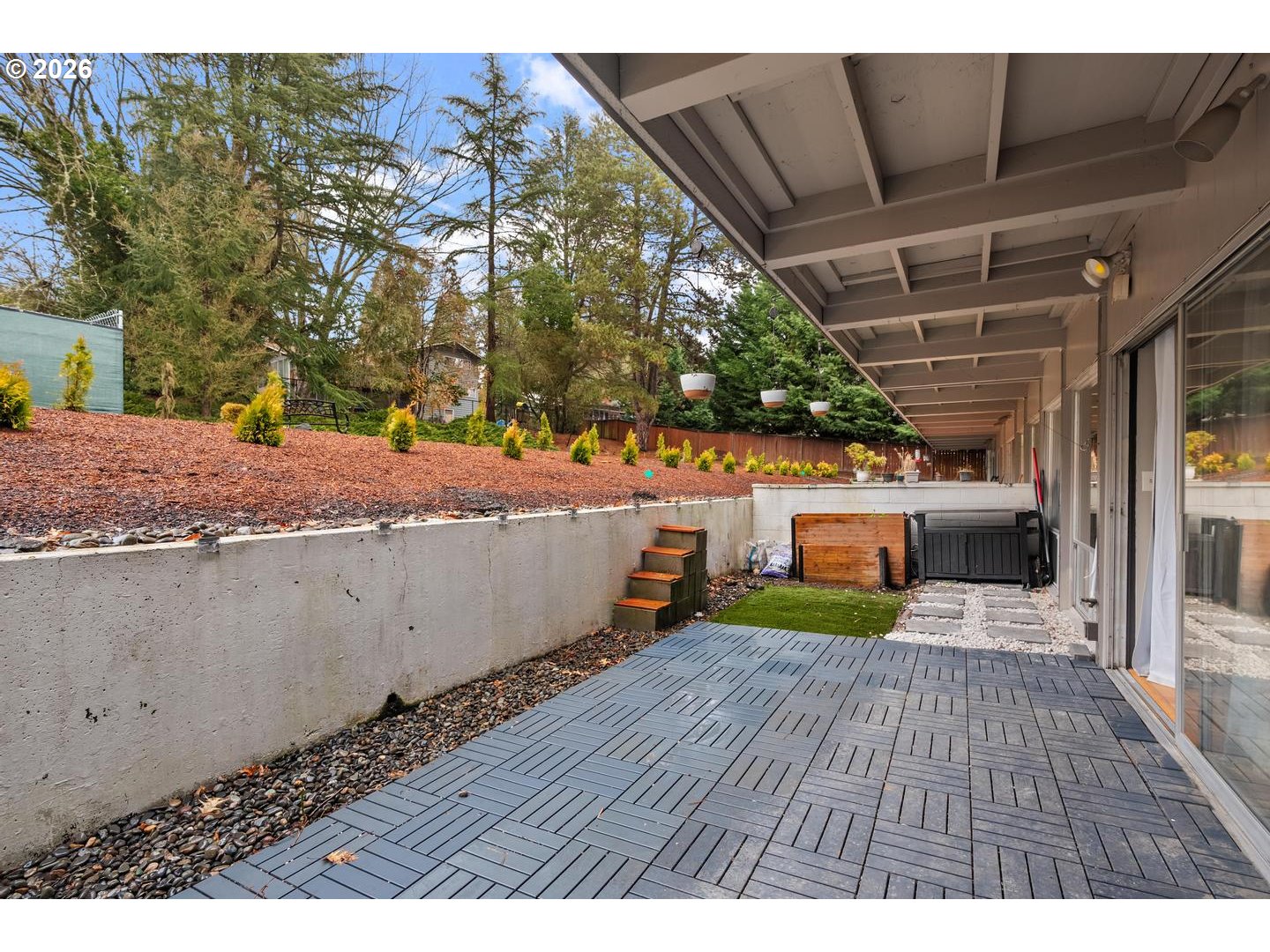 4460 Southwest Scholls Ferry Road, Unit 8 Portland, OR 97225 - Photo 24 of 31 a view of a backyard with wooden floor
