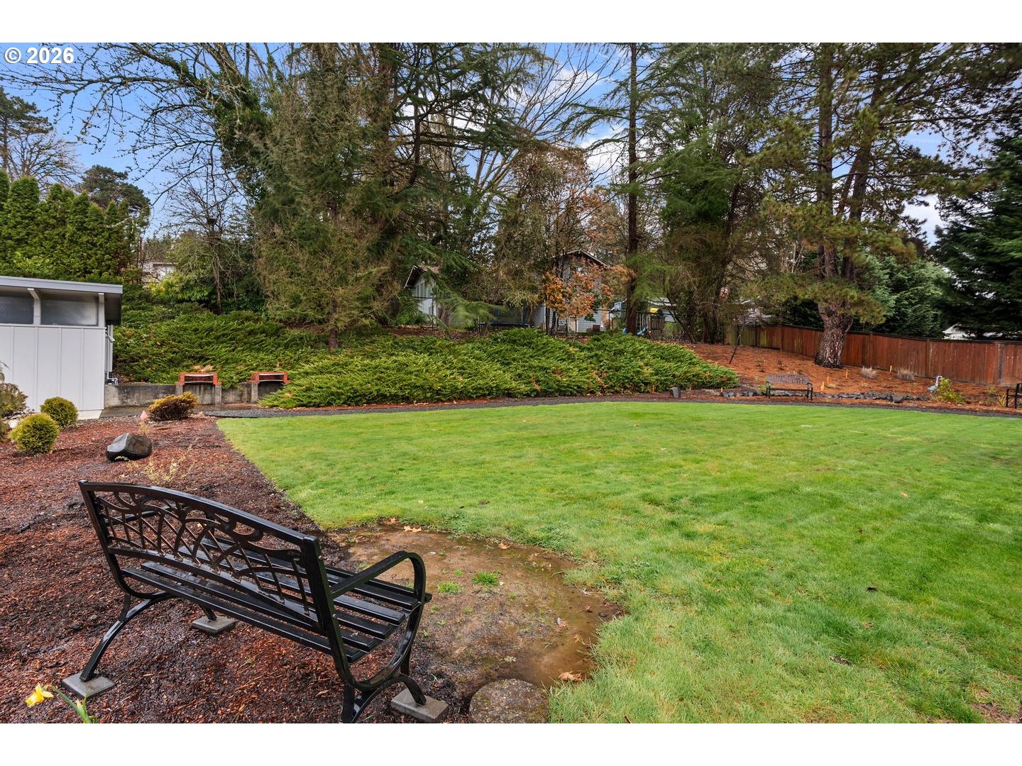 4460 Southwest Scholls Ferry Road, Unit 8 Portland, OR 97225 - Photo 27 of 31 a view of a backyard with sitting area