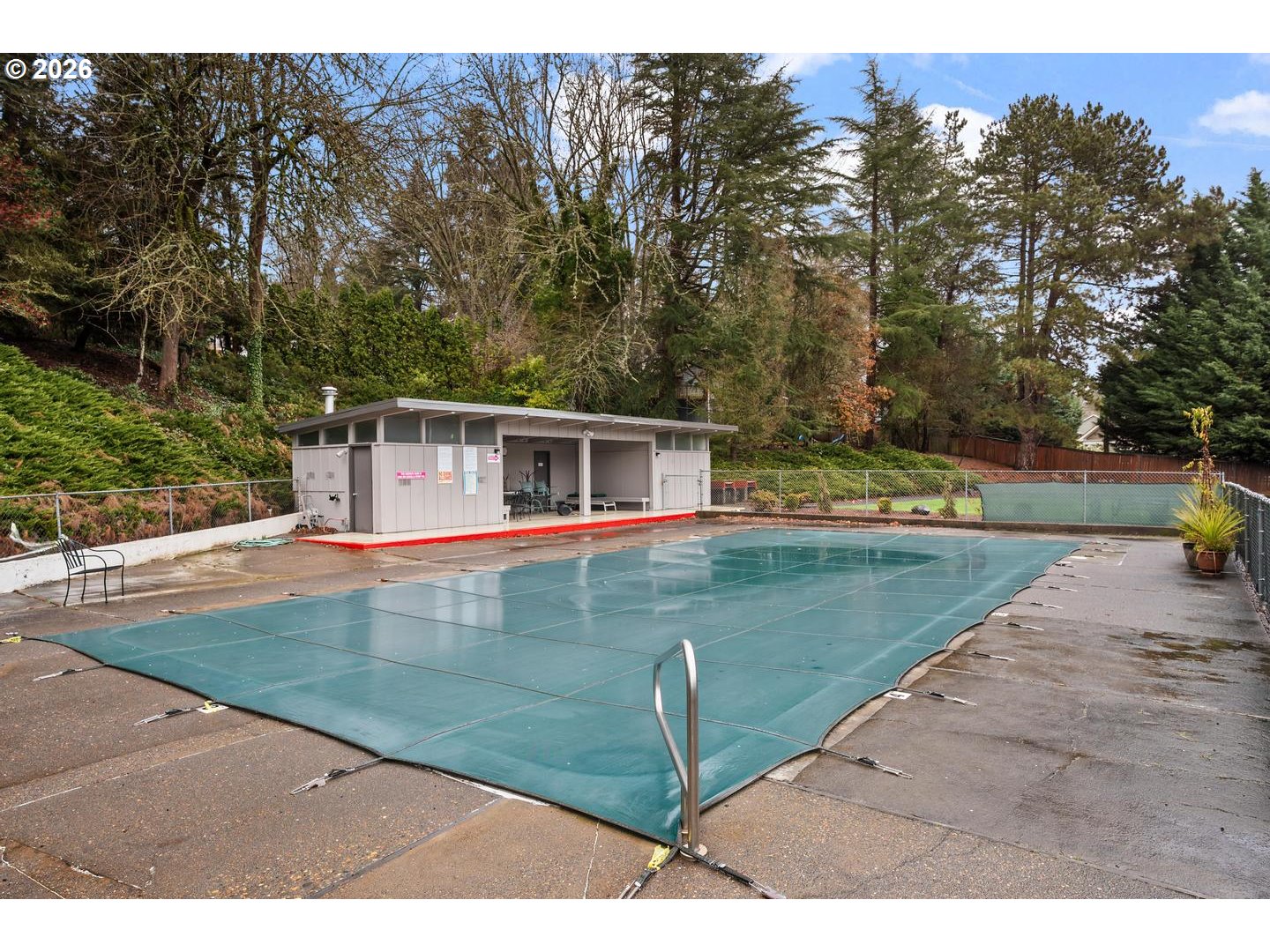 4460 Southwest Scholls Ferry Road, Unit 8 Portland, OR 97225 - Photo 29 of 31 a view of a house with a yard