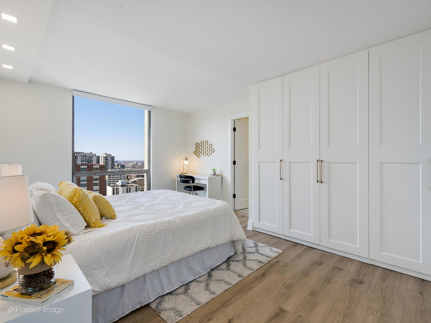 1310 North Ritchie Court, Unit 27B Chicago, IL 60610 - Photo 15 of 29 a bedroom with a bed and a couch