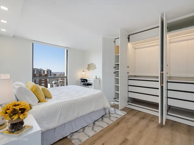 a bedroom with a bed and a dresser